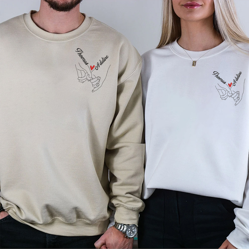 Sweat-shirt brodé main dans la main sur la poitrine gauche