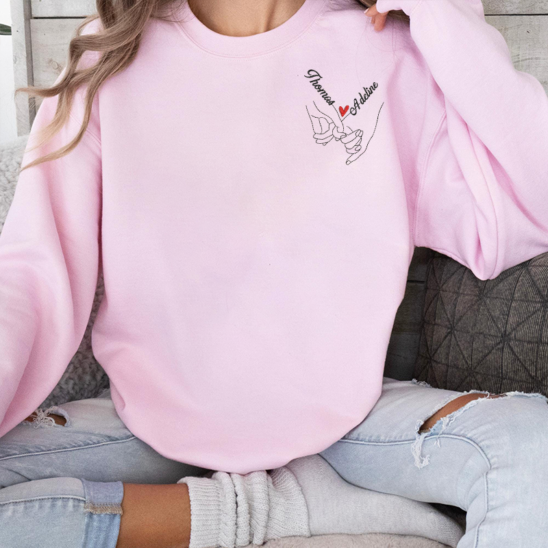 Sweat-shirt brodé main dans la main sur la poitrine gauche